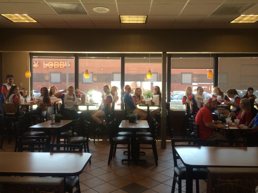 Softball stops for food on their way to the playoffs game. Heritage took a loss with the final score ending as 13-0. 