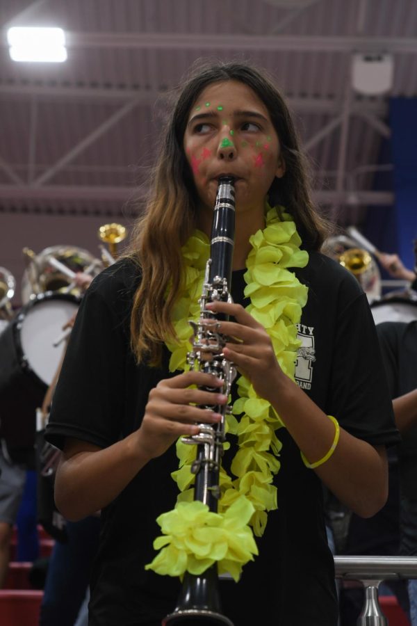 Isabella Moore (9) is playing stand tunes on her clarinet. 