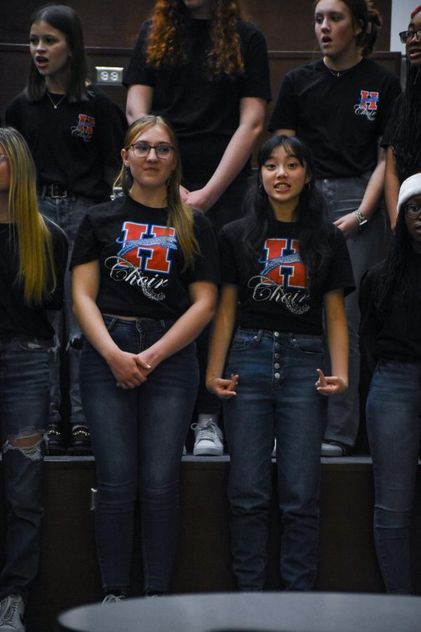 Lynsey Cagle (12) and Serena Vang (12) are singing for choir.