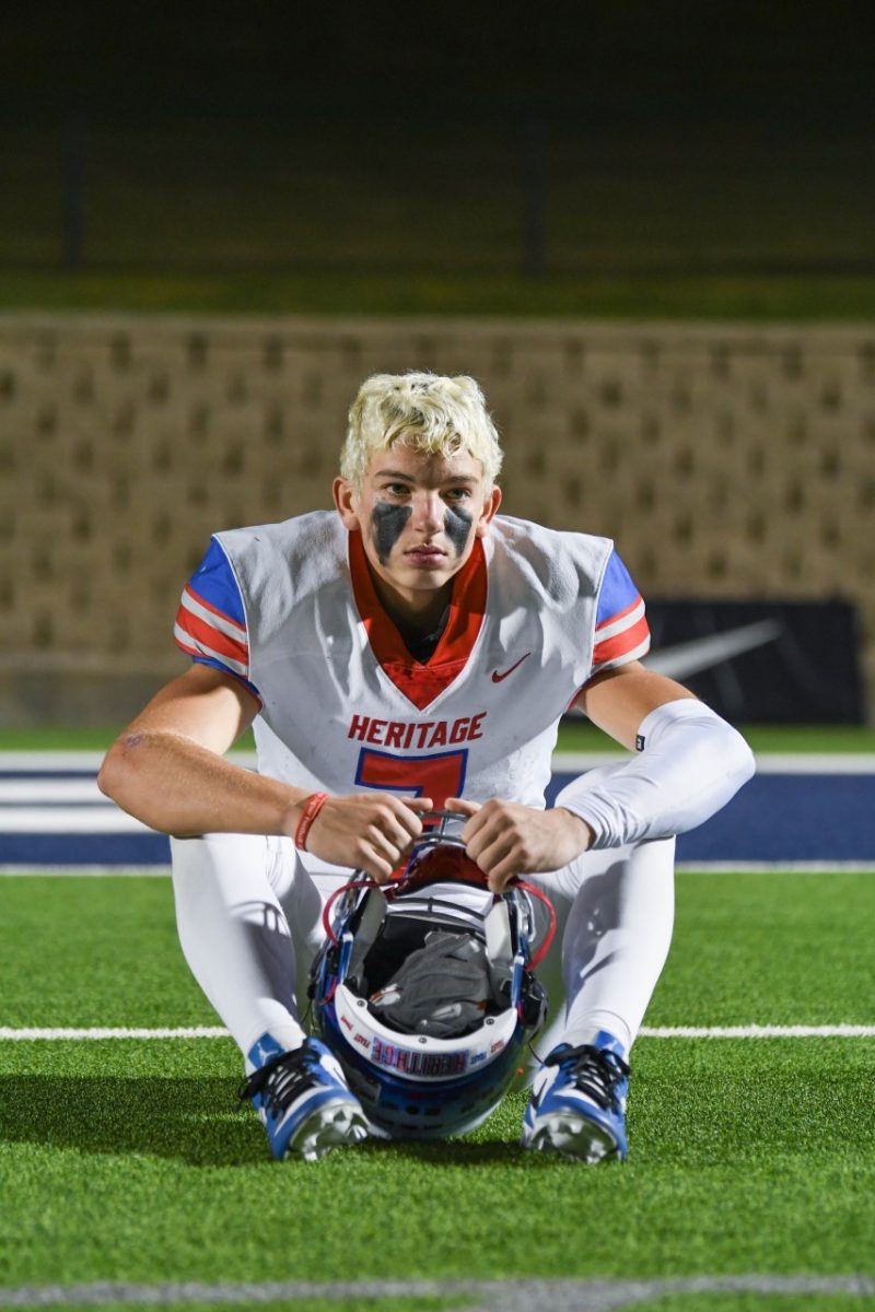 Wide receiver and defensive back Stetson Sarratt (12) sits in silence after Heritages playoff game against South Oak Cliff. The Jaguars lost this game by a score of 31-42. 